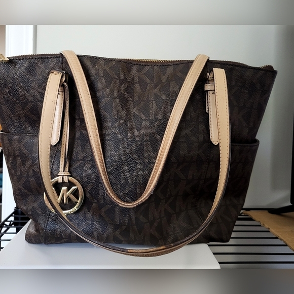 Michael Kors Handbags - Michael Kors Tan and Brown Signature East West Tote with Monogram Design*used*